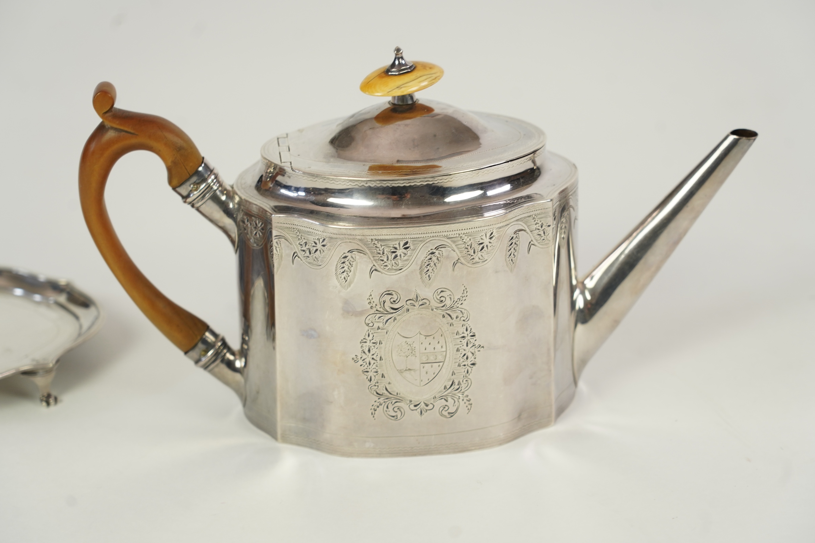 A George III silver teapot and matching stand, by Soloman Hougham